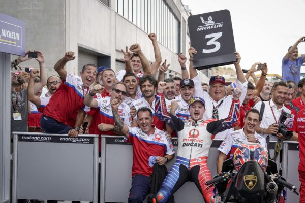 Jack Miller and his team celebrate his third-place finish in parc ferme.