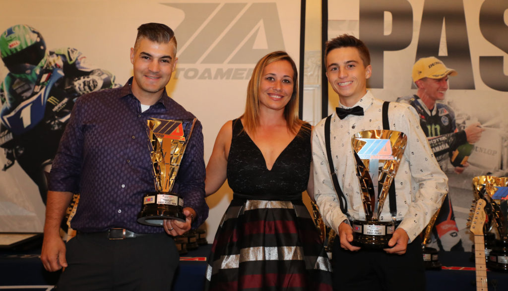 (From left to right) Team Manager Chris Ulrich, MotoAmerica Operations Manager Niccole Cox and Twins Cup Champion Alex Dumas. Photo by Brian J. Nelson.