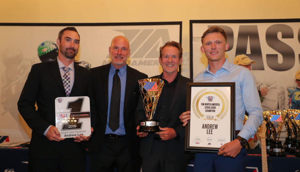 (From left to right) Crew chief Derek Keyes, Massey, MotoAmerica Communications Manager Paul Carruthers and Andrew Lee hold Lee's MotoAmerica Stock 1000 Championship awards. Photo by Brian J. Nelson.