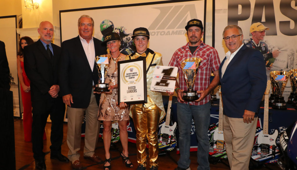 (From left to right) Massey, MotoAmerica Partner Richard Varner, Jamie Landers [Rocco's mother], Rocco Landers, Stoney Landers [Rocco's father], and Liqui Moly's Vinny Russo celebrate Rocco's Liqui Moly Junior Cup title. Photo by Brian J. Nelson.