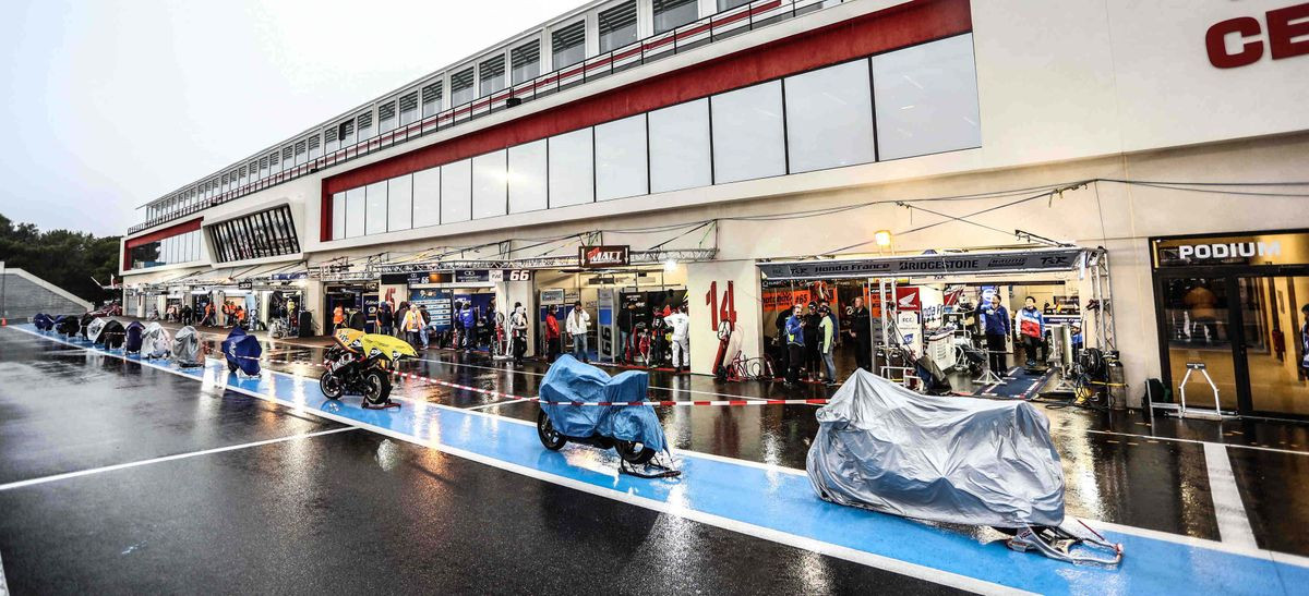 World Endurance racebikes under covers on pit lane at the Bol d'Or 24-Hours race in France.
