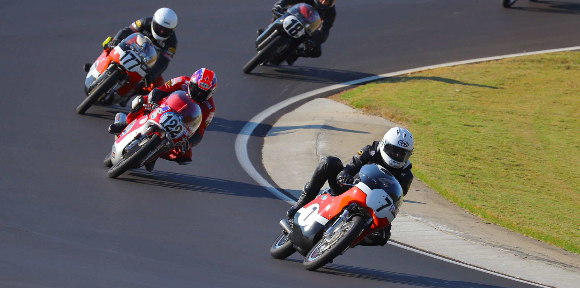 Dave Roper (7) leads Alex McLean (122), Walt Fulton (177X), and Jack Parker (18) early in the AHRMA Vintage Cup (350 GP) race on October 5 at Barber Motorsports Park. Photo by etechphoto.com, courtesy of AHRMA.