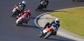 Dave Roper (7) leads Alex McLean (122), Walt Fulton (177X), and Jack Parker (18) early in the AHRMA Vintage Cup (350 GP) race on October 5 at Barber Motorsports Park. Photo by etechphoto.com, courtesy of AHRMA.