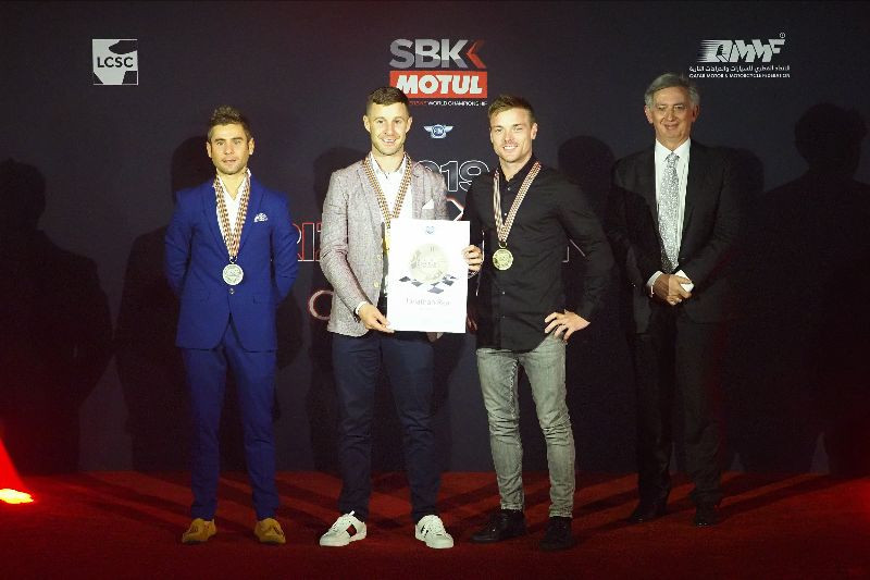 2019 FIM Superbike World Champion Jonathan Rea (second from left) with Championship runner-up Alvaro Bautista (far left), third-place Championship finisher Alex Lowes (second from right), and FIM Board Member Jos Driessen (far right). Photo courtesy of Dorna WorldSBK Press Office.