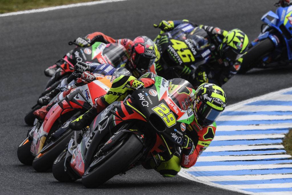 Andrea Iannone (29) leading a group of riders during the MotoGP race at Phillip Island. Photo courtesy of Aprilia Gresini Racing.