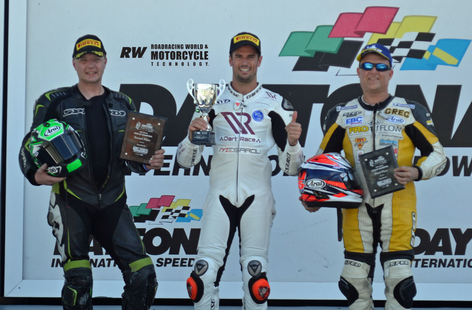 ASRA Sportbike race winner Simone Corsi (center), runner-up Jason Farrell (left), and third-place finisher Greg Melka (right) on the podium in Victory Lane at Daytona International Speedway. Photo by David Swarts.