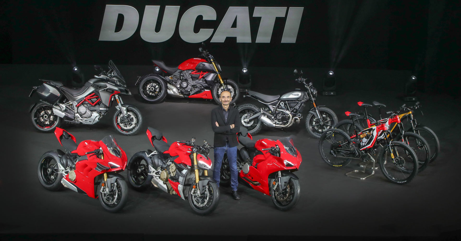 Ducati CEO Claudio Domenicali with Ducati's new 2020-model motorcycles and Ebikes. Photo courtesy of Ducati.