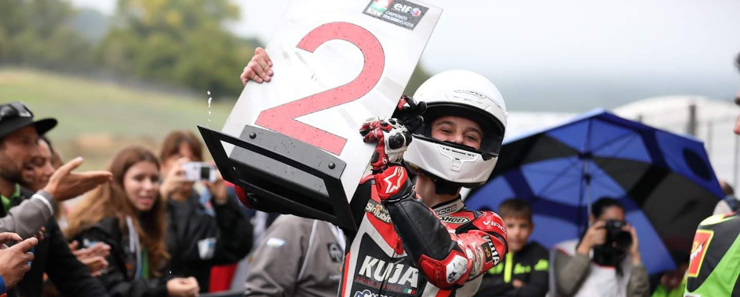 American Max Toth celebrates his second-place finish in a CIV PreMoto3 race in parc ferme at Mugello.