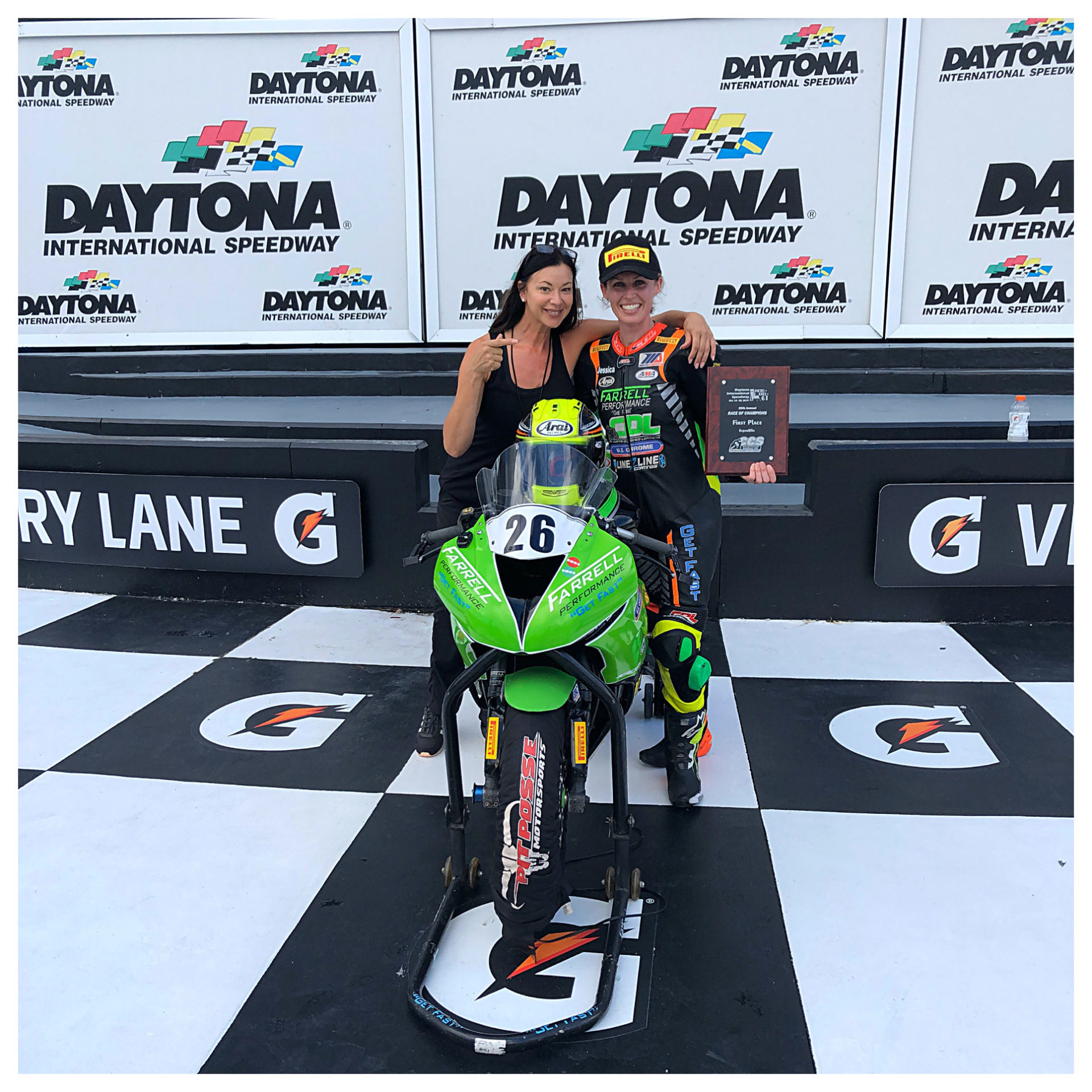 Angela Izzo-Sink, Operating Director of MotoGirlGT Roadracing Championship Series (left), and MotoGirlGT Superbike race winner Jessica Capizzi (right) in Victory Lane at Daytona International Speedway. Photo courtesy of Angela Izzo-Sink.