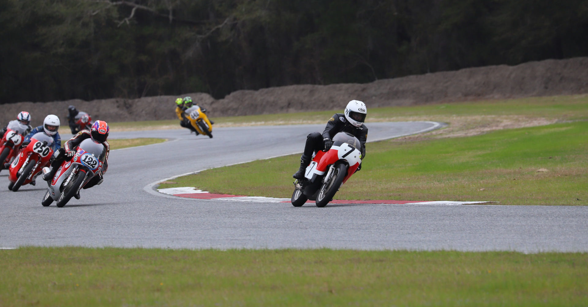 Dave Roper (7) leading an AHRMA 350 GP/Vintage Cup race in 2019. Photo by etechphoto.com, courtesy of AHRMA.