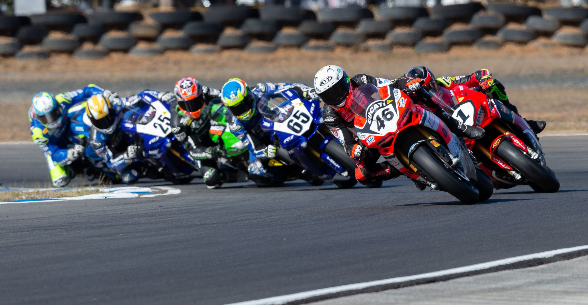 Australian Superbike front-runners Mike Jones (46), Troy Herfoss (1), Cru Halliday (65), Bryan Staring (behind Halliday), Daniel Falzon (25), and Josh Waters (behind Falzon). Photo by Andrew Gosling/TBG Sport, courtesy of Motorcycling Australia.