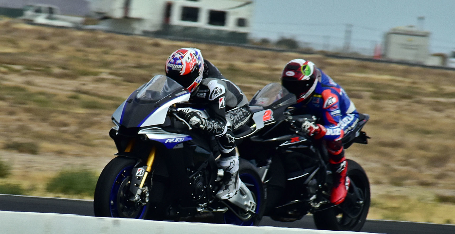 Former MotoGP World Champion Casey Stoner (left) and former AMA Superbike Champion Josh Herrin (right) on the main straight at Willow Springs International Raceway. Photo by Michael Gougis.