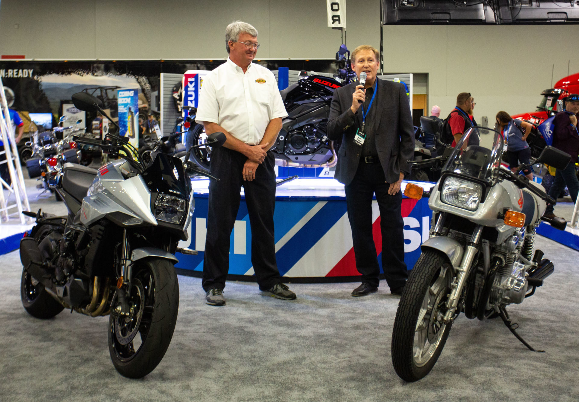 Barber Museum’s Jeff Ray (left) and Suzuki's Kerry Graeber (right) with the original 1982 GSX1100S Katana and the 2020 KATANA in Metallic Mystic Silver and Solid Black. Photo courtesy of Suzuki Motor of America., Inc.