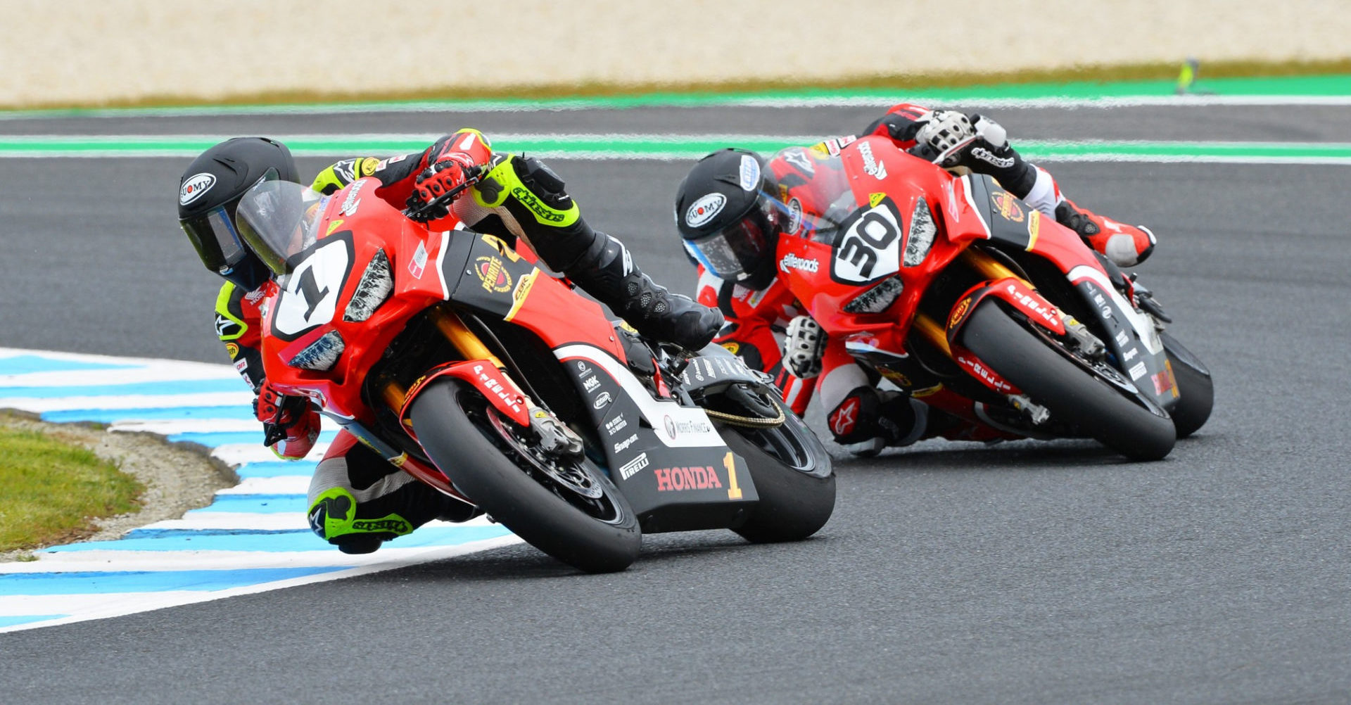 Troy Herfoss (1) and Mark Chiodo (30) in action at Phillip Island. Photo by Russell Colvin/Foremost Media, courtesy of Penrite Honda.