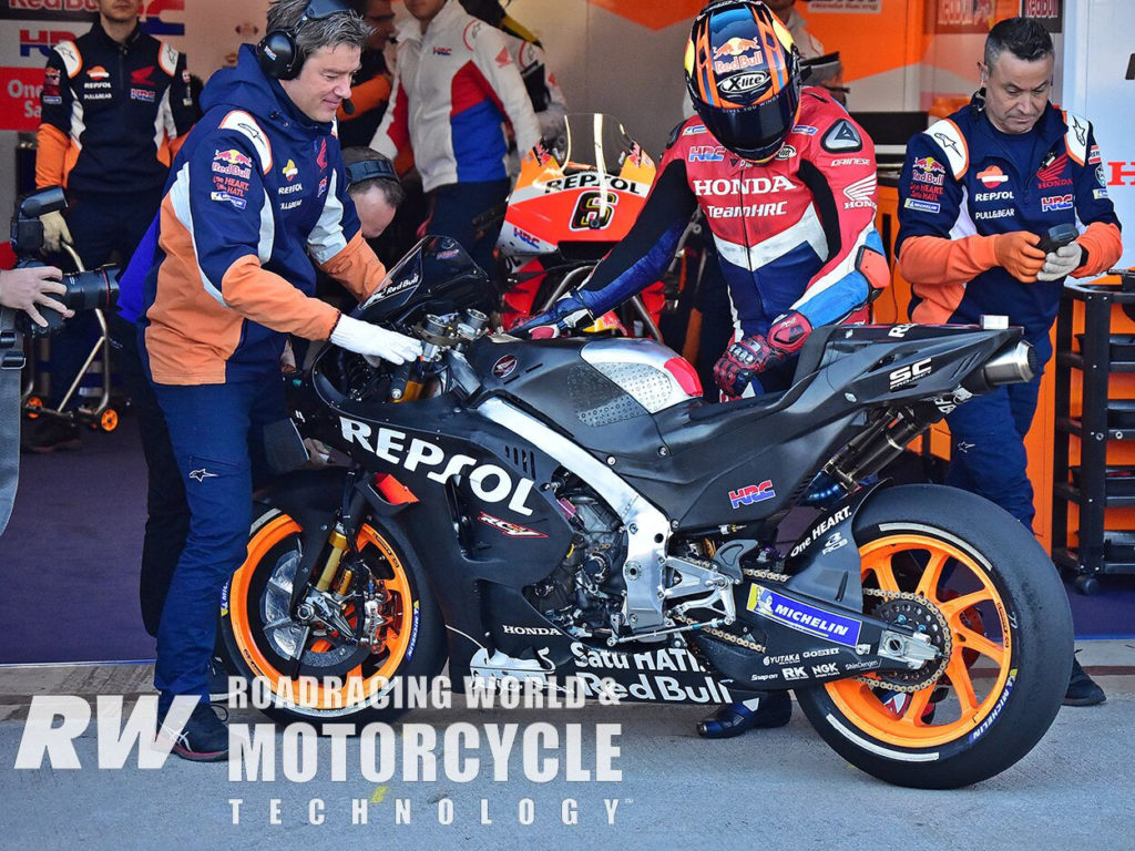 (Above) Early in the morning, Stefan Bradl tested with reflective material over the front brakes, designed to help keep heat in the discs. Photo by Michael Gougis.