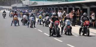 Vintage motorcycles on pit lane at Phillip Island during a past International Island Classic event. Photo courtesy of Phillip Island Grand Prix Circuit.