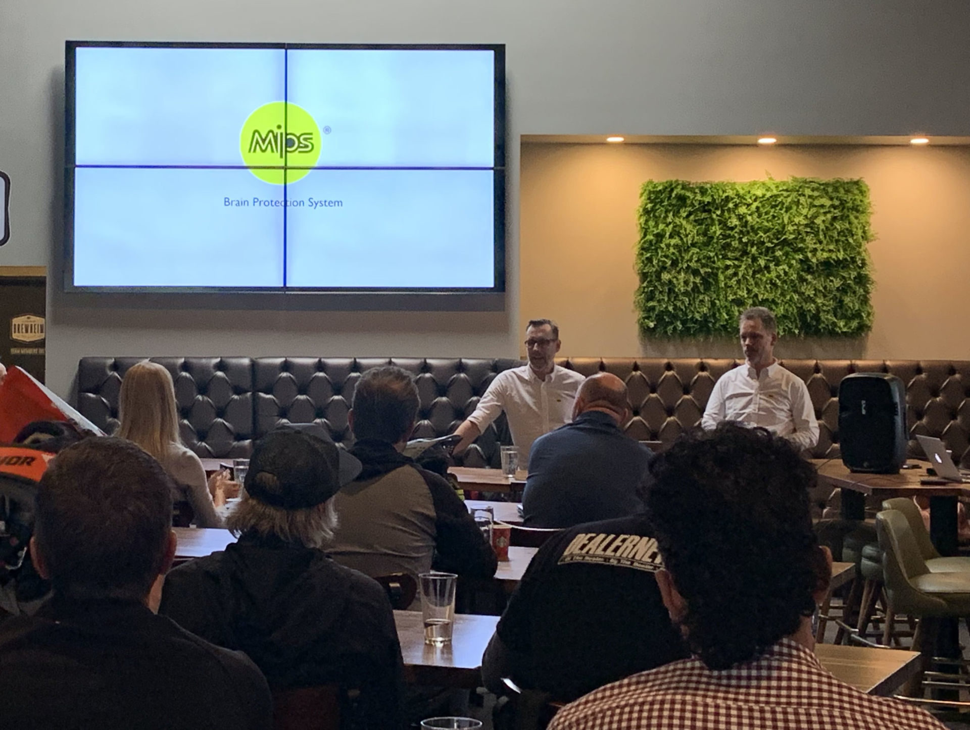 MIPS CEO Max Strandwitz (left) and Co-Founder/Chief Science Officer Peter Halldin (right) speaking with members of the media November 20 in Anaheim, California. Photo courtesy of Next Level Sports, Inc.