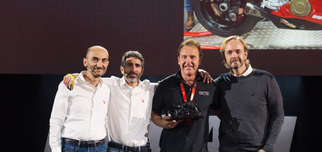 Ducati CEO Claudio Domenicali (left), Ducati VP Global Sales & After Sales Director Francesco Milicia (second from left), AMS Ducati Dallas Founder and President Jeff Nash (second from right), and Ducati North America CEO Jason Chinnock (right) on stage at the Ducati Global Dealer Conference in Rimini, Italy. Photo courtesy of Ducati North America.