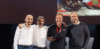 Ducati CEO Claudio Domenicali (far left), Ducati VP Global Sales & After Sales Director Francesco Milicia (second from left), AMS Ducati Dallas Founder and President Jeff Nash (second from right), and Ducati North America CEO Jason Chinnock (far right) on stage at the Ducati Global Dealer Conference in Rimini, Italy. Photo courtesy of Ducati North America.