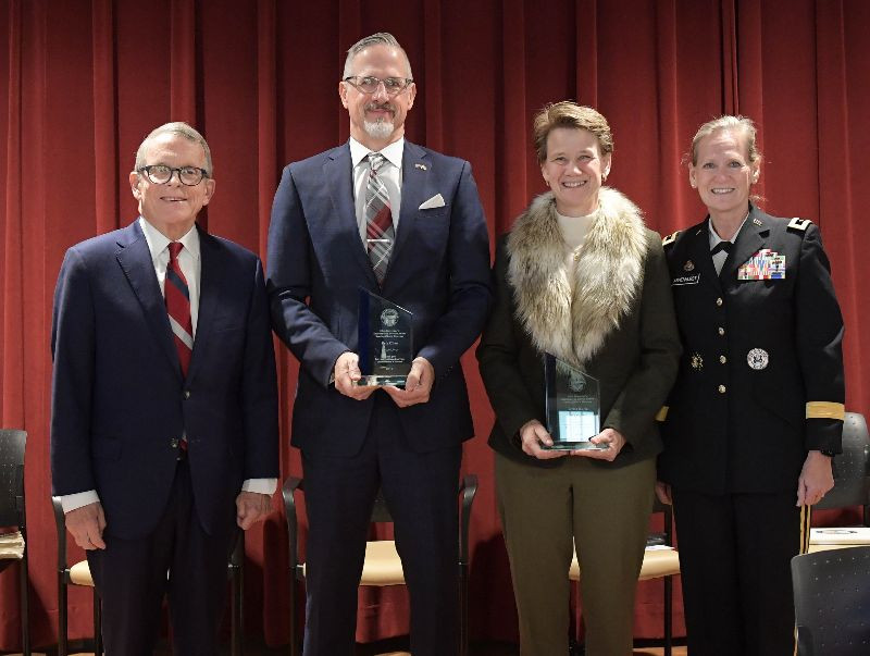 Peter Cline was one of two honorees recognized this past Veterans Day during a special presentation held at the Ohio Veterans Home in Georgetown, Ohio. Presenting the award was Governor Mike DeWine and the Director of the Ohio Department of Veteran Services MajGen (Ret.) Deborah A. Ashenhurst. (Photo left to right; award co-recipient Peter Cline, Ohio Governor Mike DeWine, award co-recipient Terese Hurin, Director of the Ohio Department of Veteran Services MajGen (Ret.) Deborah A. Ashenhurst. Photo courtesy of The Ohio Department of Veteran Services and VETMotorsports.