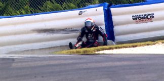 N2 Holding AirFence Fundraiser for RWAF Kyle Wyman, after crashing into Roadracing World Action Fund Airfence at 104 mph in Turn One at Barber Motorsports Park. Photo courtesy of beIN SPORTS USA.