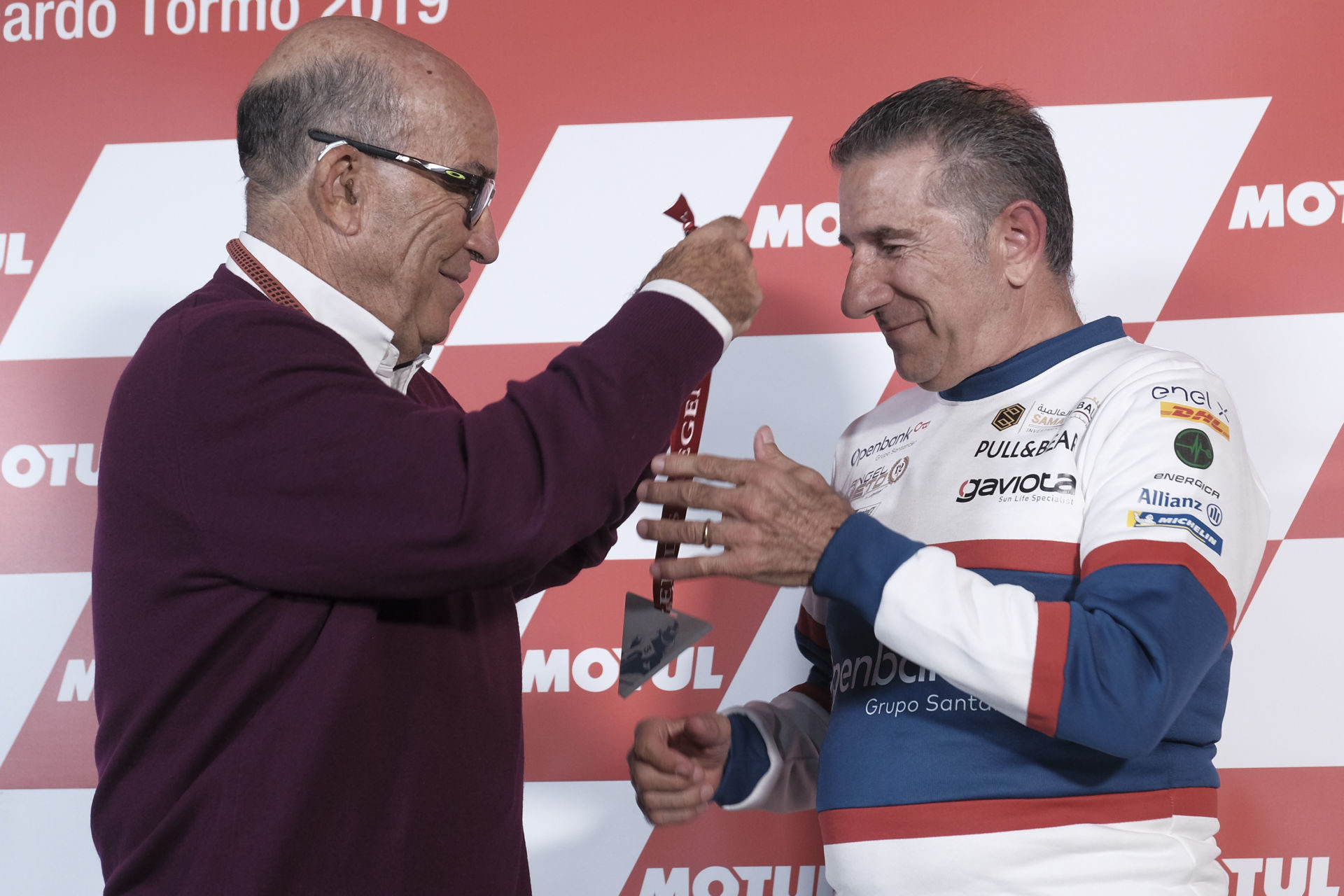 Jorge Martinez (right) receiving his MotoGP Legend medal from Dorna CEO Carmelo Ezpeleta (left) during a ceremony today in Valencia. Photo courtesy of Dorna/www.motogp.com.