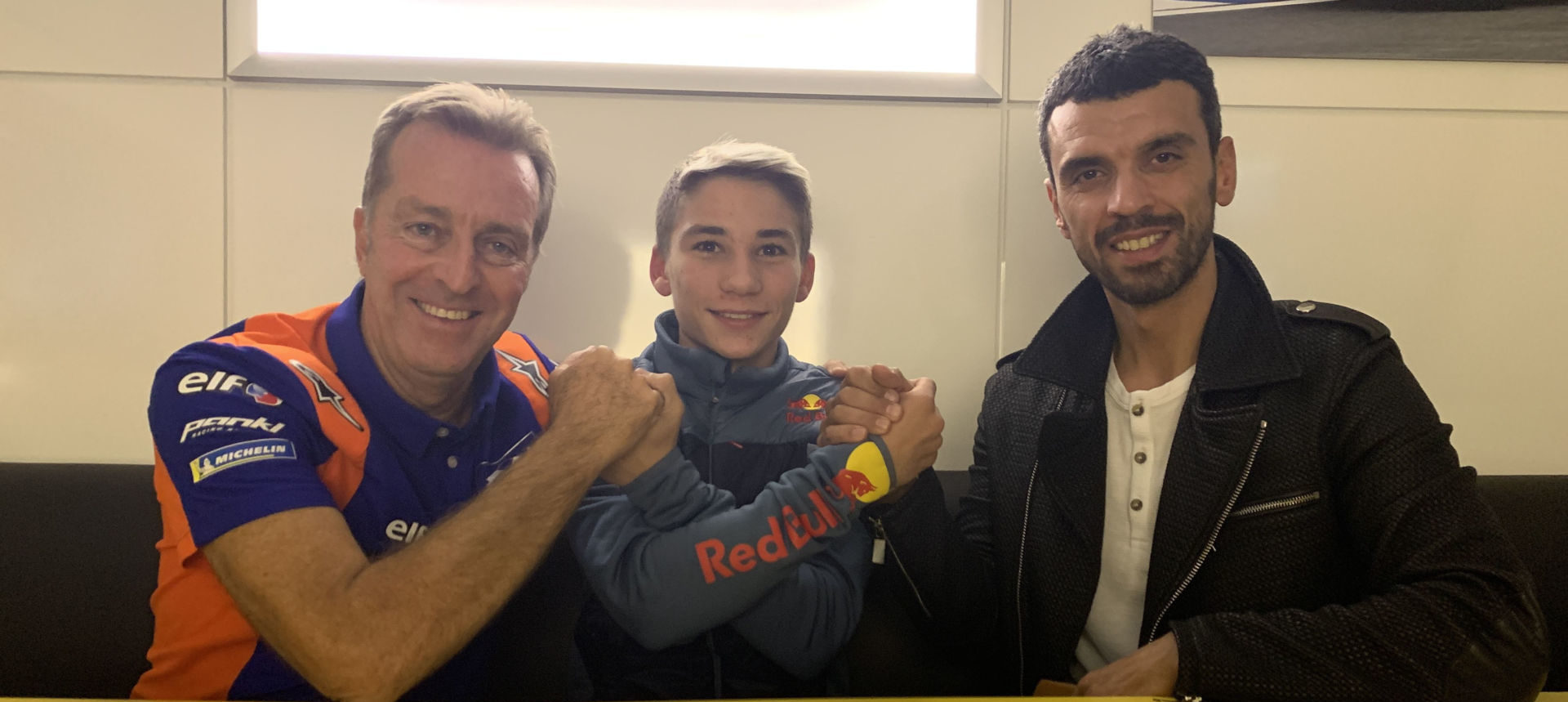 Deniz Öncü (center) with Tech3 Racing Team Principal Hervé Poncharal (left) and Turkish rider Kenan Sofuoglu (right), a retired multi-time FIM Supersport World Champion. Photo courtesy of Red Bull KTM Tech3.