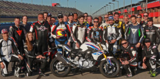 Fastrack Academy V coaches Chris Ulrich, Eric Bostrom, Jake Zemke and Josh Hayes (subbing for Jeremy Toye) and participants with the grand prize, a BMW G 310 R, at Auto Club Speedway. Photo by CaliPhotography.com, courtesy of Fastrack Academy.