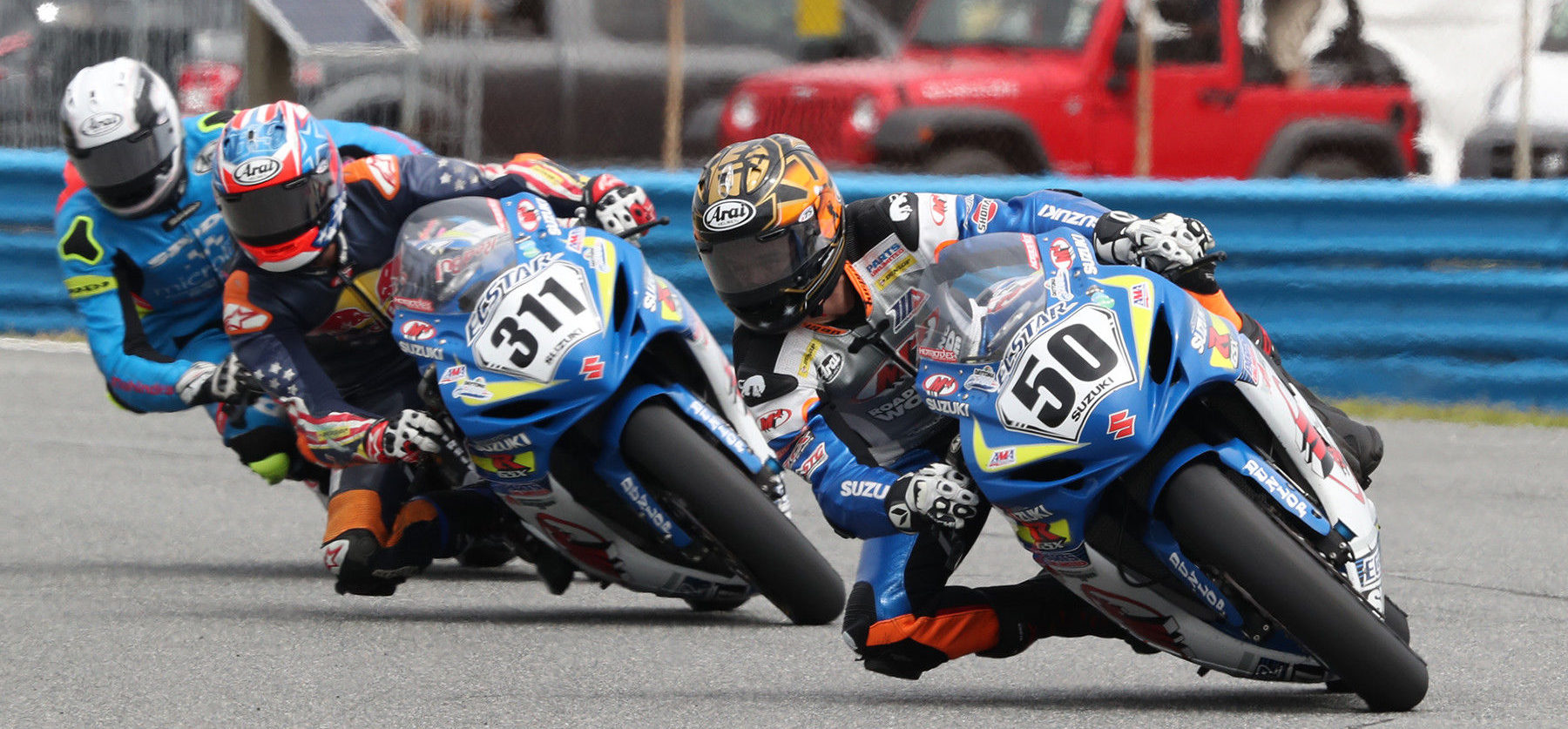 Bobby Fong (50), Sean Dylan Kelly (311), and Brandon Paasch (behind Kelly) in action during the 78th Daytona 200. Photo courtesy of Daytona International Speedway and AMA.