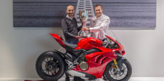 Ducati CEO Claudio Domenicali (left) accepting the British Superbike (BSB) Manufacturer Championship trophy from BSB Series Director Stuart Higgs (right) at Ducati’s headquarters in Bologna, Italy. Photo courtesy of Ducati.