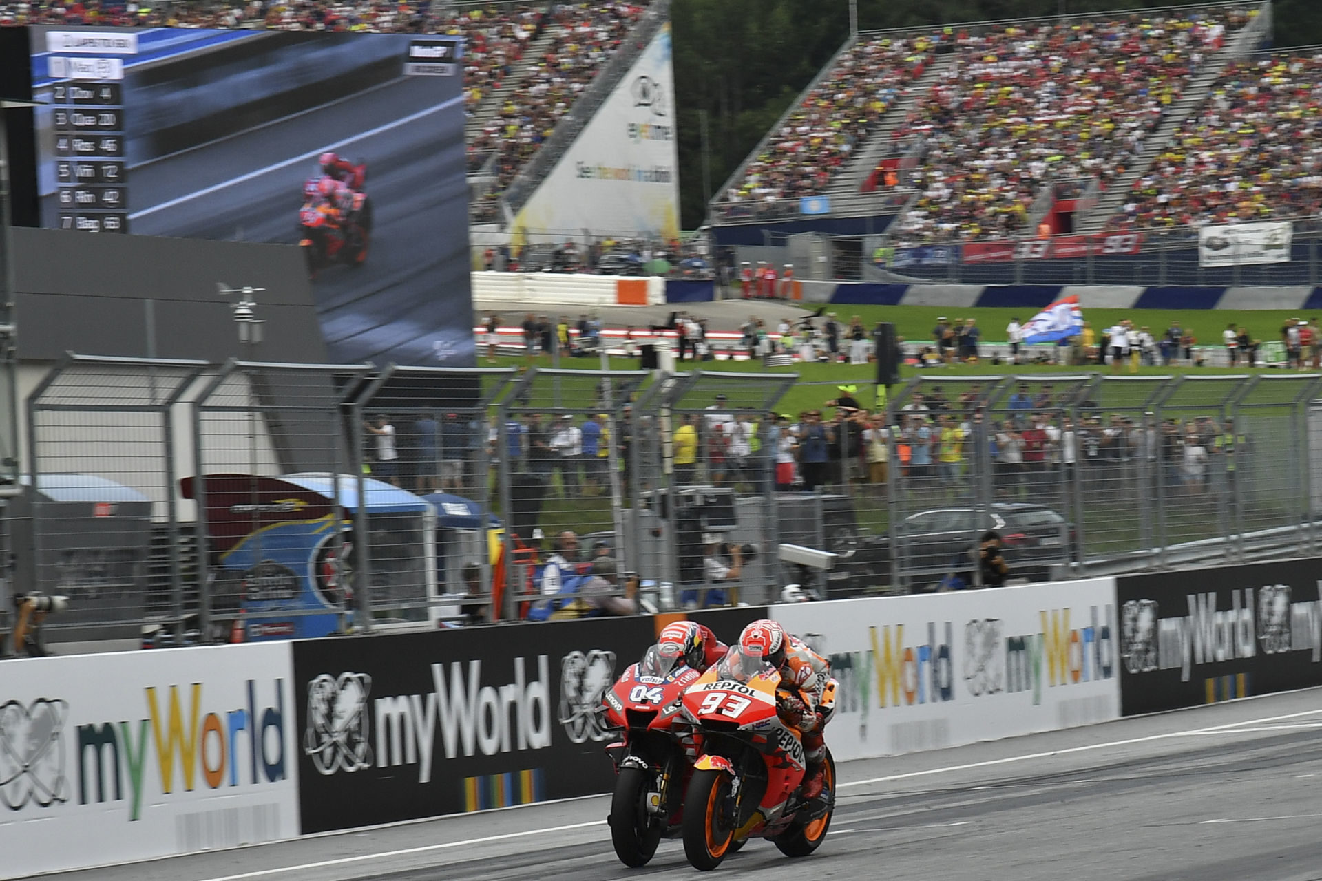 Marc Marquez (93) and Andrea Dovizioso (04) battled to the finish of the 2019 Austrian Grand Prix at the Red Bull Ring, in Austria. Photo courtesy of Dorna/www.motogp.