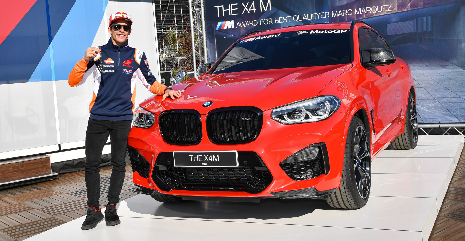 Marc Marquez with the BMW M Award grand prize - a BMW X4 M Competition. Photo courtesy of Dorna.