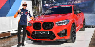 Marc Marquez with the BMW M Award grand prize - a BMW X4 M Competition. Photo courtesy of Dorna.