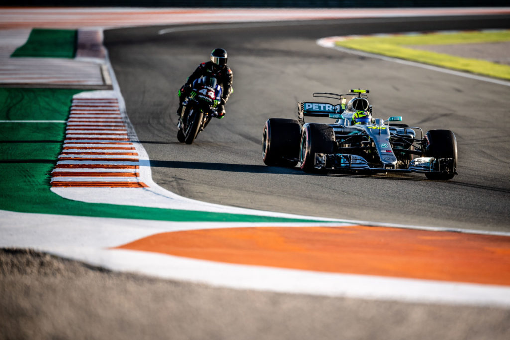 Formula One race car driver Lewis Hamilton on a Monster Energy Yamaha YZR-M1 MotoGP racebike (44) and MotoGP racer Valentino Rossi (46) in a Mercedes-AMG F1 W08 EQ Power+ Formula One race car (46) at Valencia. Photo courtesy of Monster Energy Yamaha.