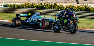 Formula One race car driver Lewis Hamilton (44) on a Monster Energy Yamaha YZR-M1 MotoGP racebike and MotoGP racer Valentino Rossi (46) in a Mercedes-AMG F1 W08 EQ Power+ Formula One race car at Valencia. Photo courtesy of Monster Energy Yamaha.