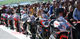 Fans and retired Aprilia racebikes lined up at Aprilia All Stars in 2019. Photo courtesy of Aprilia.