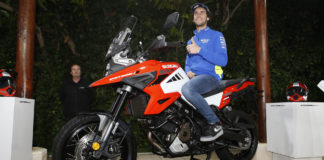 Alex Rins poses on a Suzuki V-STROM 1050. Photo courtesy of Team Suzuki Press Office.