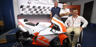 Herman Tomczyk, ADAC Sports President (left); Carmelo Ezpeleta, CEO of Dorna Sports (center); and Pit Beirer, KTM Motorsports Director (right), with a KTM RC4R racebike at the announcement of the Northern Talent Cup. Photo courtesy of Dorna.