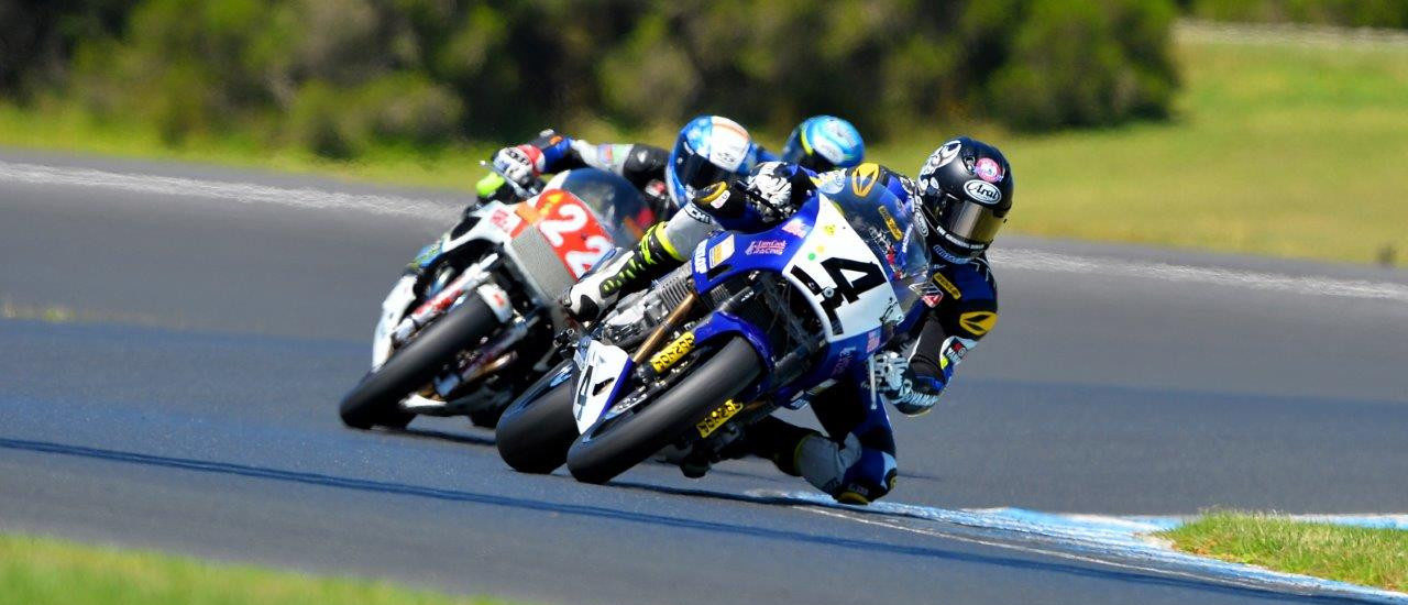 Josh Hayes (4) leads Jed Metcher (22) at Phillip Island. Photo by Russell Colvin, courtesy of Phillip Island Grand Prix Circuit.