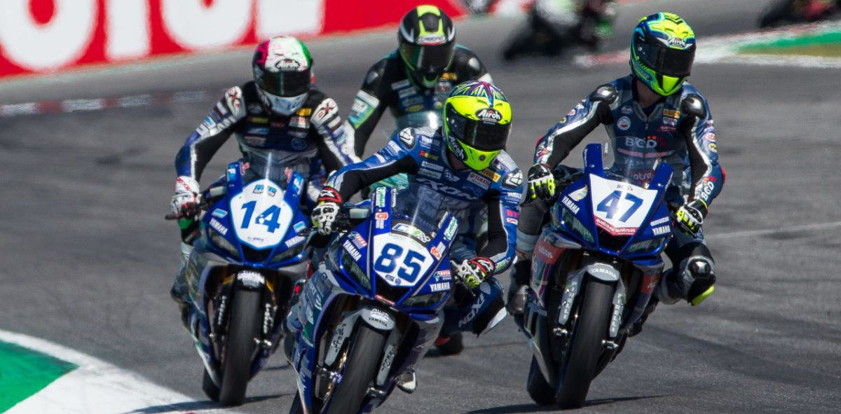 Riders at speed on Yamaha YZF-R3 racebikes. Photo courtesy of Yamaha.