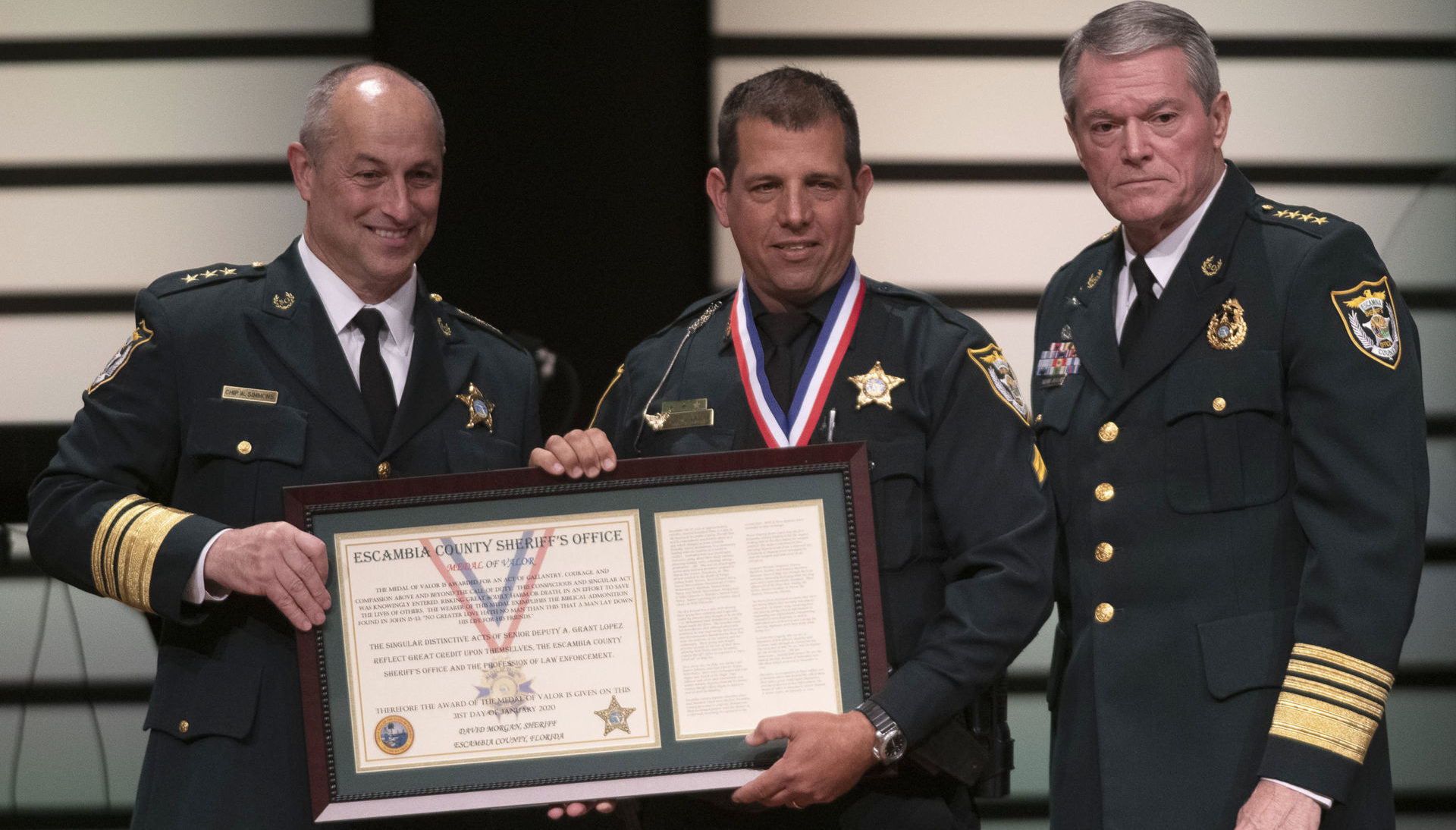 Escambia County Sheriff David Morgan (left), Senior Deputy A. Grant Lopez (center), and Chief Deputy Chip Simmons (right) at the Escambia County Sheriff’s Office award ceremony January 31, 2019, in Pensacola, Florida. Photo courtesy of the Escambia County Sheriff’s Office.