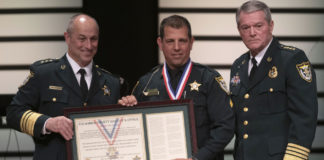 Escambia County Sheriff David Morgan (left), Senior Deputy A. Grant Lopez (center), and Chief Deputy Chip Simmons (right) at the Escambia County Sheriff’s Office award ceremony January 31, 2019, in Pensacola, Florida. Photo courtesy of the Escambia County Sheriff’s Office.