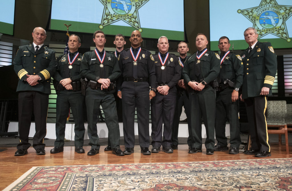 Grant Lopez (second from right) with the other law enforcement officers who were decorated for their actions on December 6, 2019. Photo courtesy of Escambia County Sheriff’s Office. 