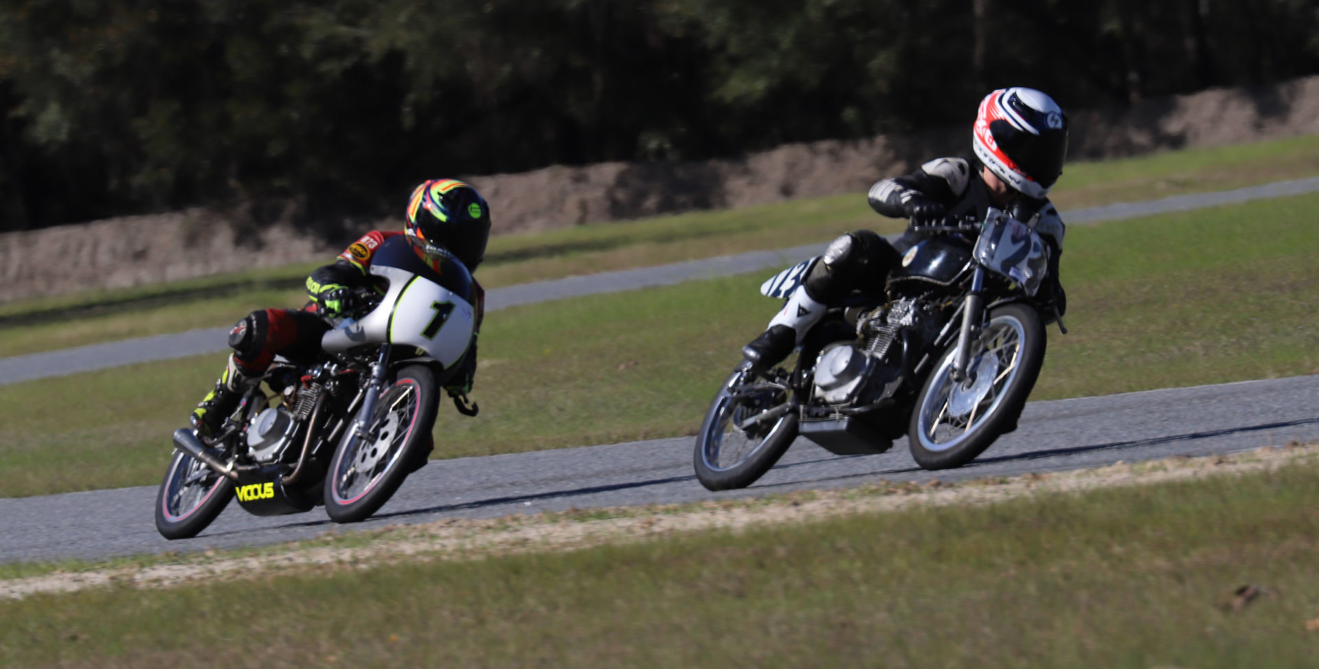 Jonas Stein (123) leads Greg Glevicky (1) during an AHRMA race at Roebling Road Raceway. Photo by etechphoto.com, courtesy of AHRMA.