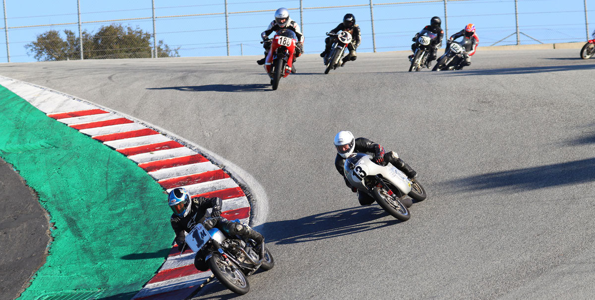 AHRMA racers Greg Tomlinson (1M), Jason Lindquist (13), Jarl Wathne (188), Mica Grohn (2V), Dustin Johnson (760), and Alex McLean (122) coming down the Corkscrew at WeatherTech Raceway Laguna Seca. Photo by etechphoto.com, courtesy of AHRMA.