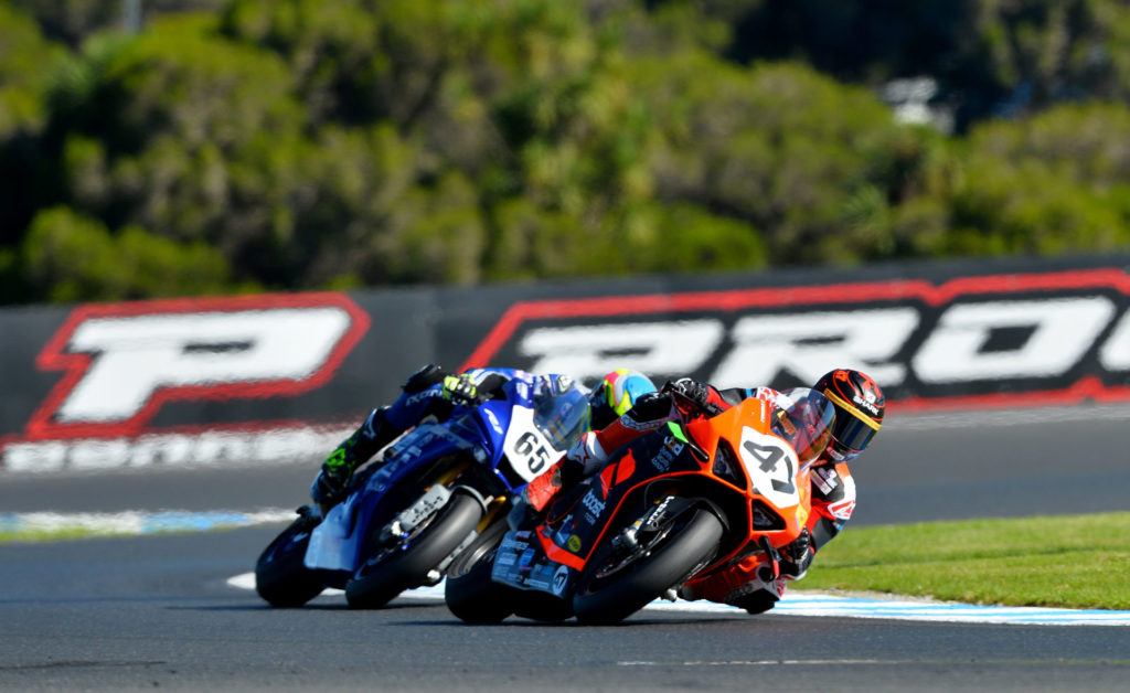 Wayne Maxwell (47) leads Cru Halliday (65) during Race Two at Phillip Island. Photo by Russell Colvin, courtesy Motorcycling Australia.