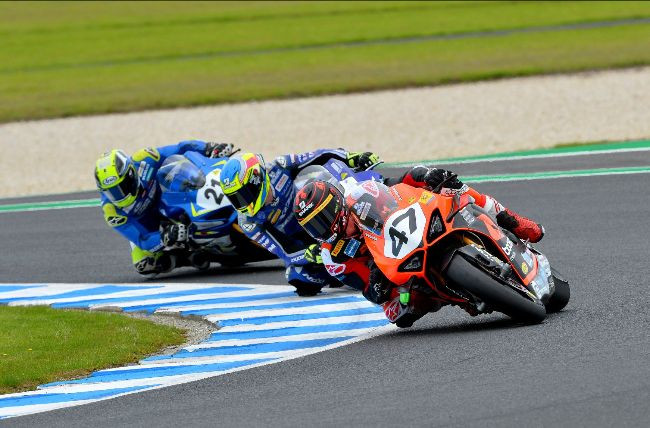 Wayne Maxwell (47) leads Cru Halliday and Josh Waters (25) during Race One at Phillip Island. Photo by Russell Colvin, courtesy of Motorcycling Australia.