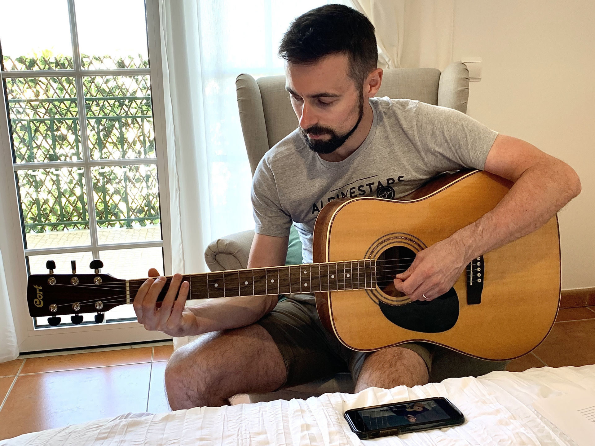 World Superbike racer Eugene Laverty taking an online guitar lesson Photo courtesy of BMW Motorrad Motorsport.