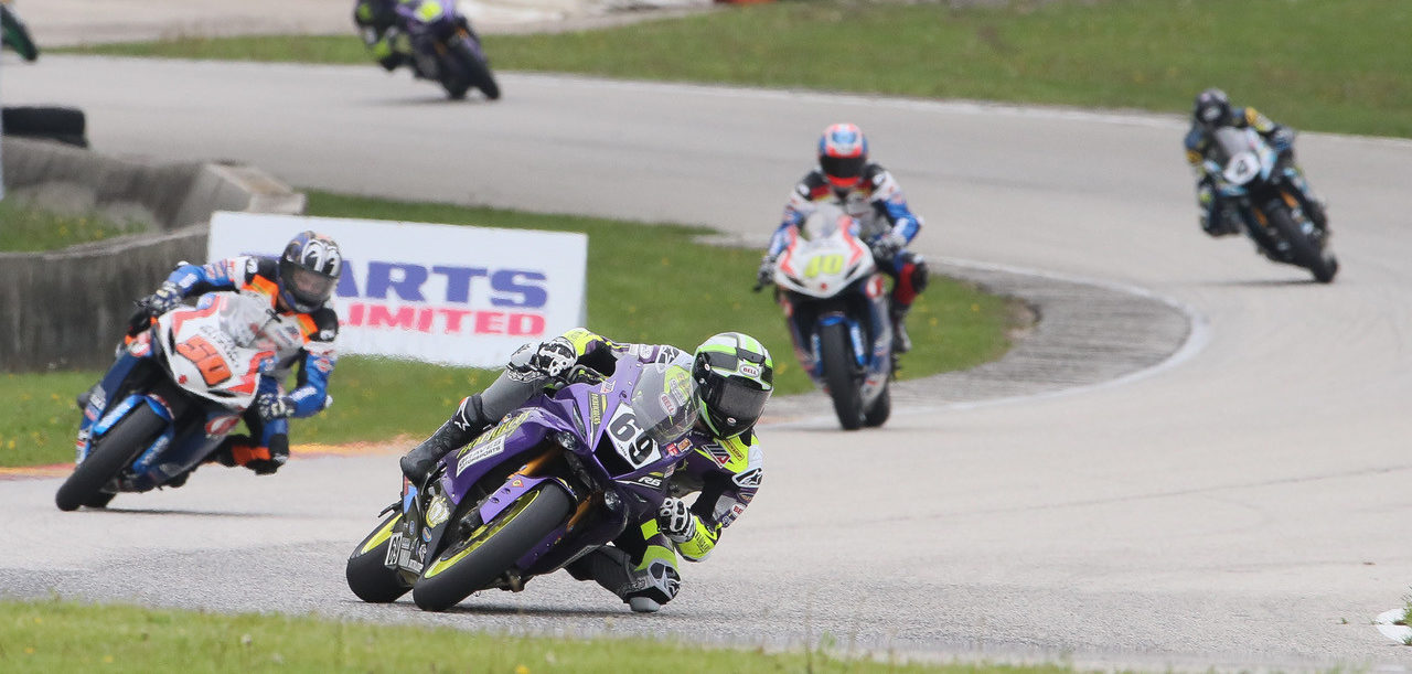 Hayden Gillim (69) leading Bobby Fong (50), Sean Dylan Kelly (40), and Josh Hayes (4) during a MotoAmerica Supersport race at Road America in 2019. Photo by Brian J. Nelson.