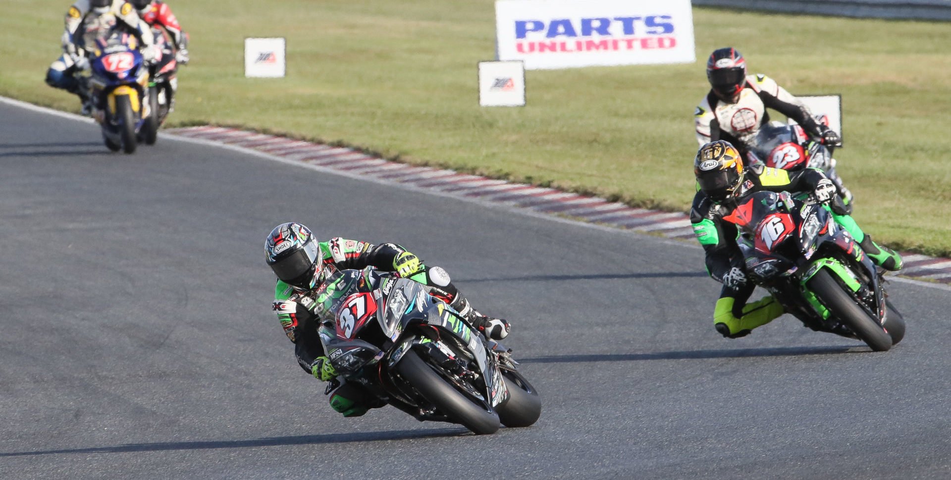 Stefano Mesa (37) leading Frankie Babuska, Jr. (16), Corey Alexander (23), and Miles Thornton (72) during the MotoAmerica Stock 1000 race at New Jersey Motorsports Park in 2019. Photo by Brian J. Nelson.